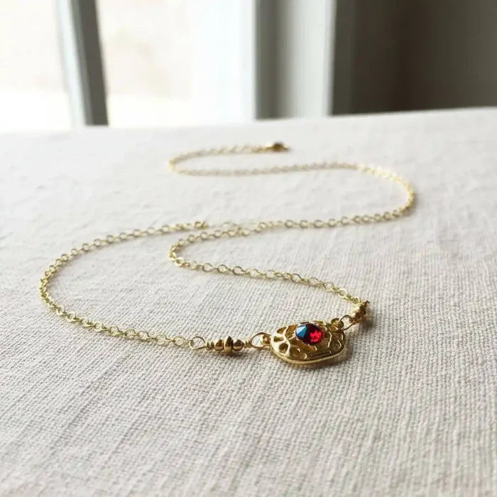 Red Crystal 14 K Gold Filled Adjustable Filigree Choker with gold chain and red Swarovski crystal centerpiece.