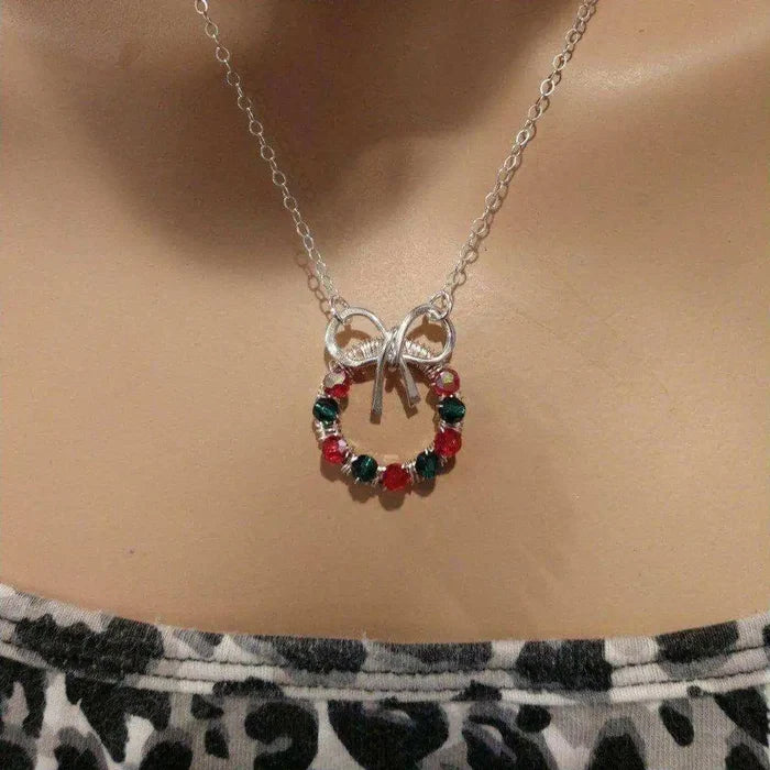 Red Green Crystal Christmas Wreath Necklace Special Edition displayed on a mannequin, showcasing festive holiday charm.
