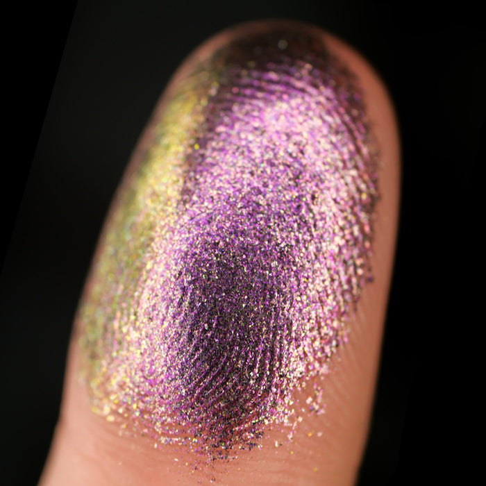 Macro finger swatch on fair skin tone of Redox Dimensional Multichrome Eyeshadow