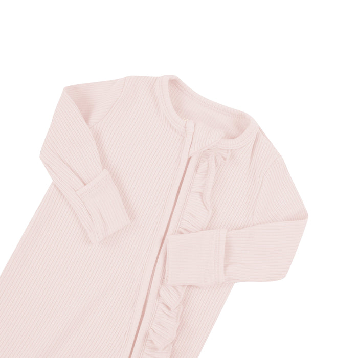 Fold-over cuffs on Kyte Baby Ribbed Ruffle Zippered Footie in Blush pink