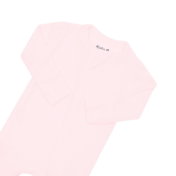 Fold-over cuffs on Kyte Baby Ribbed Zippered Footie in Sakura