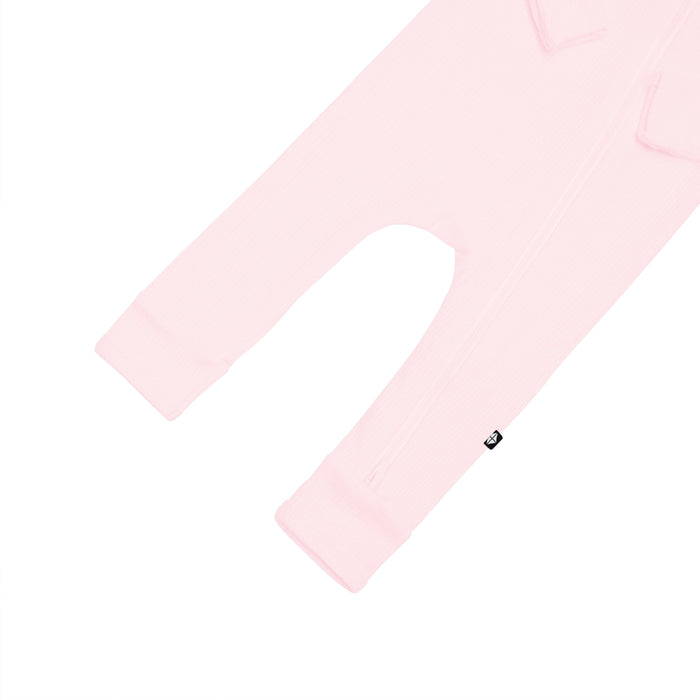 Open feet on Kyte Baby Ribbed Zippered Romper in Sakura