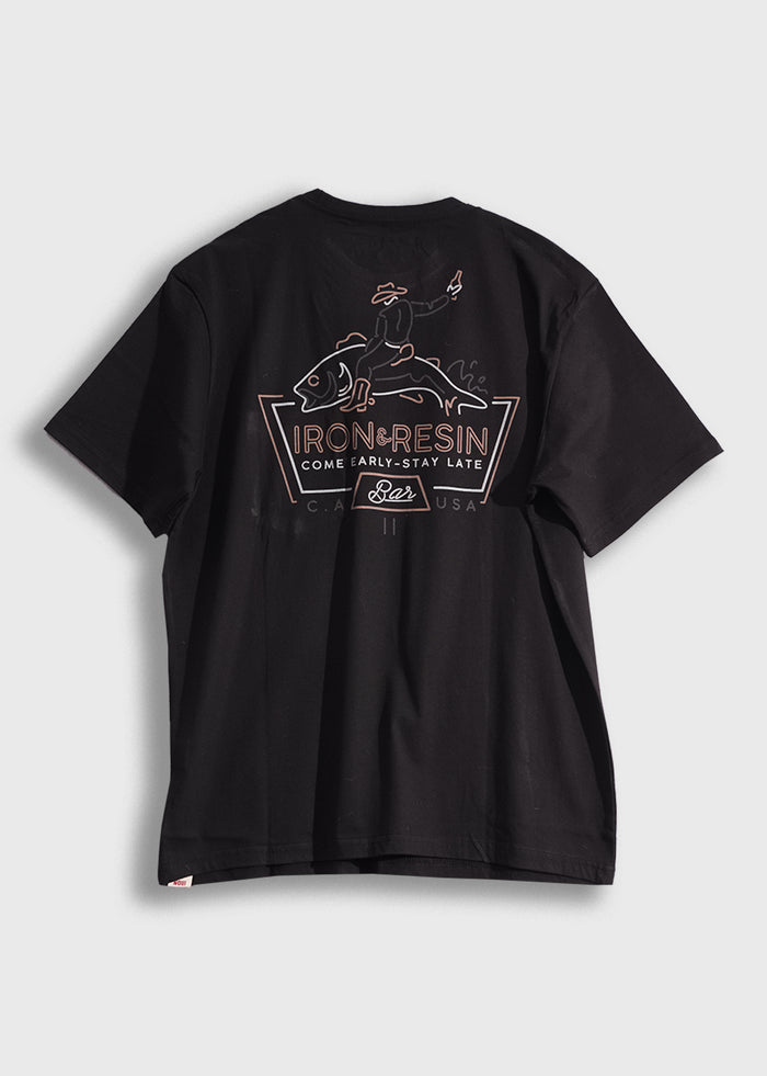 Black T-shirt with "Iron & Resin" logo, featuring a graphic of a cowboy riding a fish, and the slogan "Come Early-Stay Late."