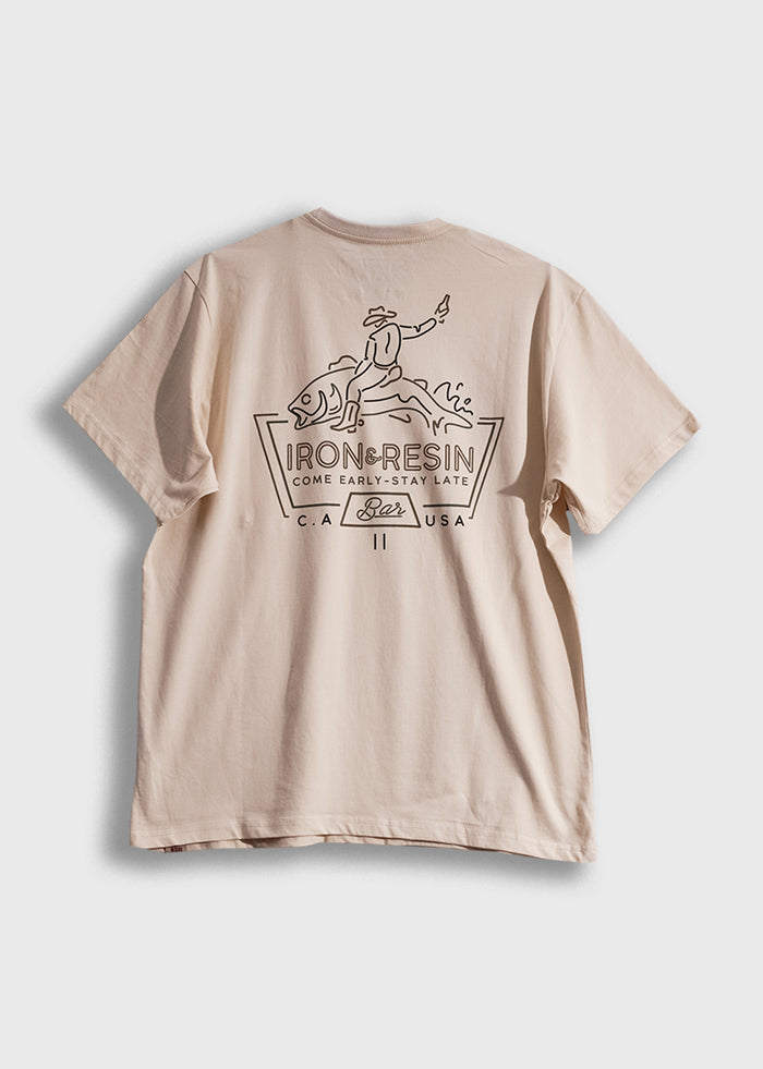 Beige T-shirt with Iron & Resin logo, featuring a cowboy riding a fish, and text "Come Early-Stay Late" in bold design.