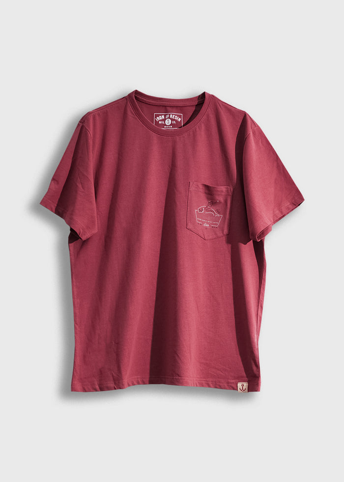 Red T-shirt with a chest pocket featuring a small graphic, displayed against a plain background.