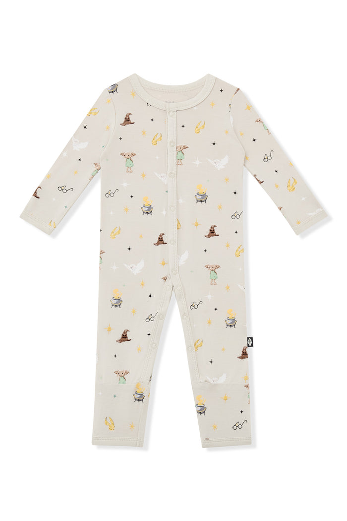 Beige snap romper with Harry Potter prints on a white background