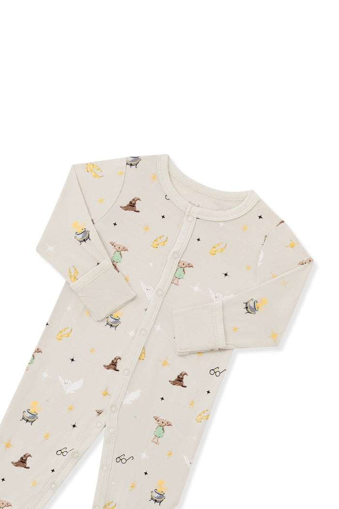 Top part of Beige snap romper with Harry Potter prints on a white background