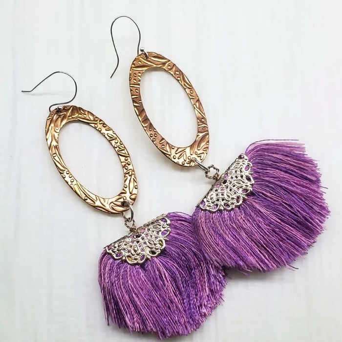 Rose Gold Filigree Silk Tassel Earrings Copper Embossed with purple silk tassels and intricate metalwork.