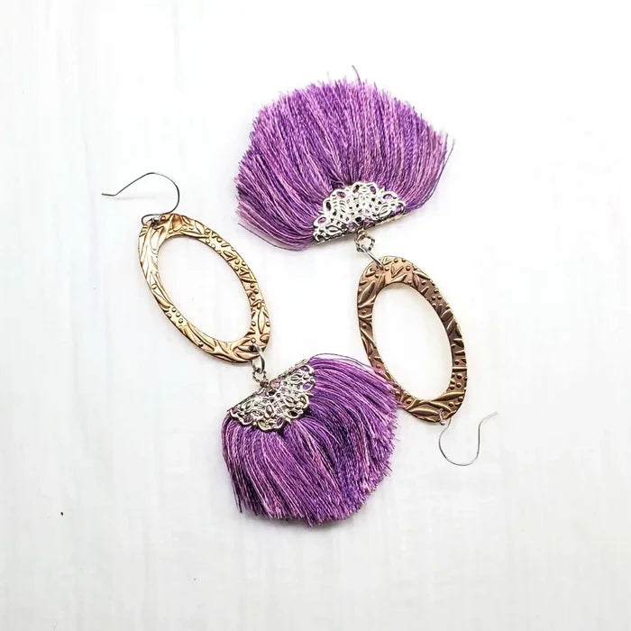 Rose Gold Filigree Silk Tassel Earrings Copper Embossed showcasing intricate metalwork and vibrant purple silk tassels.