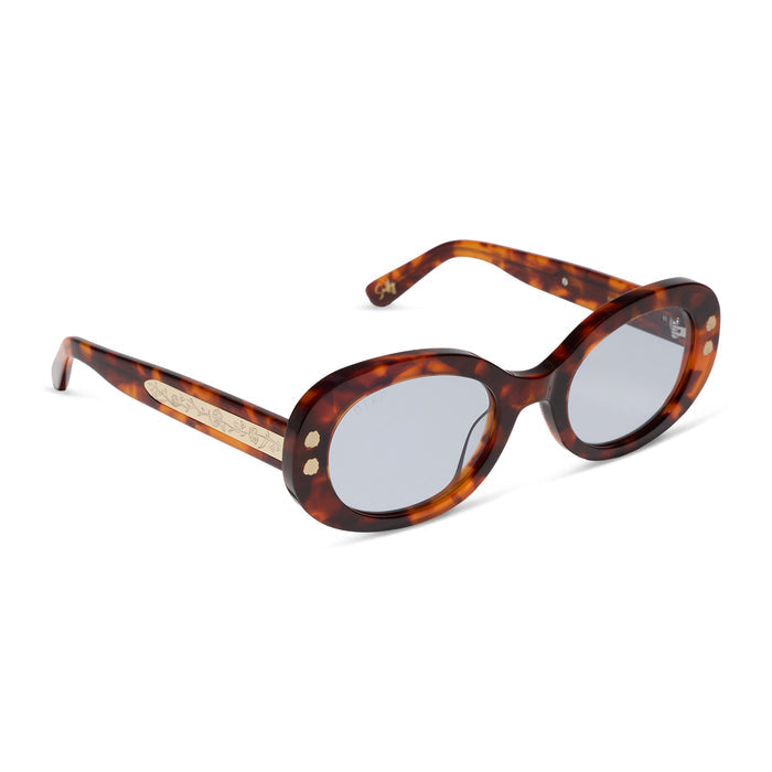 diff eyewear x practical magic 2 featuring the sally oval sunglasses with a tortoise frame and light blue lenses angled view