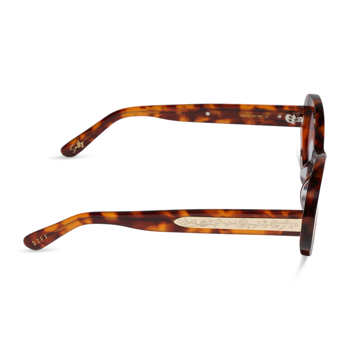 diff eyewear x practical magic 2 featuring the sally oval sunglasses with a tortoise frame and light blue lenses side view