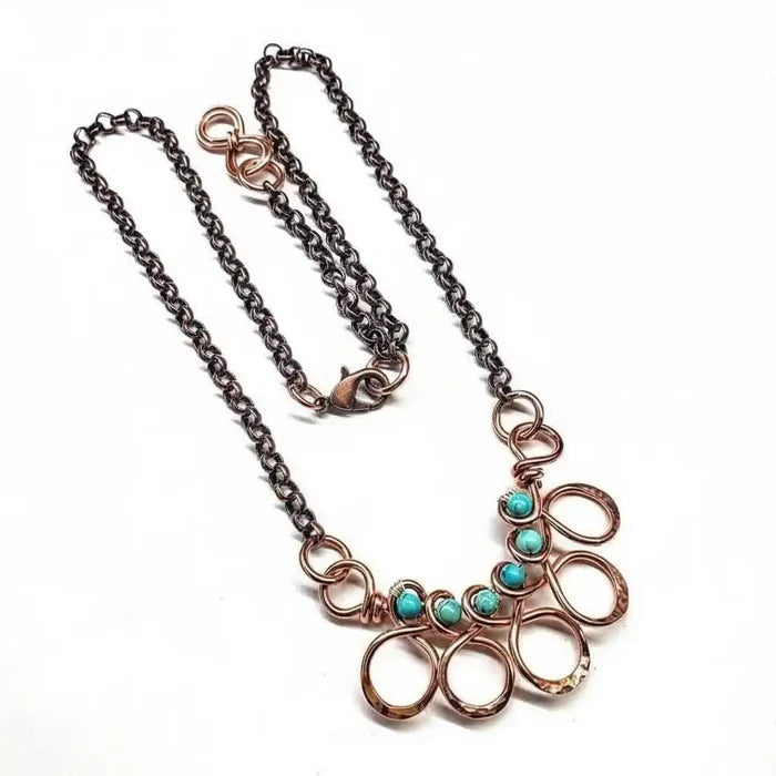 Seen on Ashley Liao Copper Turquoise Wire Wrapped Necklace features a unique design with turquoise stones and copper chains.