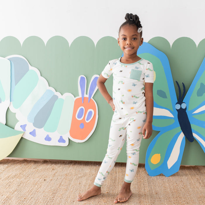 Girl wearing Short Sleeve Very Hungry Caterpillar Pajamas with pants