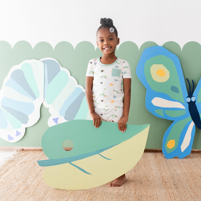 Girl wearing Short Sleeve and Pants Kids Pajamas in The Very Hungry Caterpillar™ and Friends