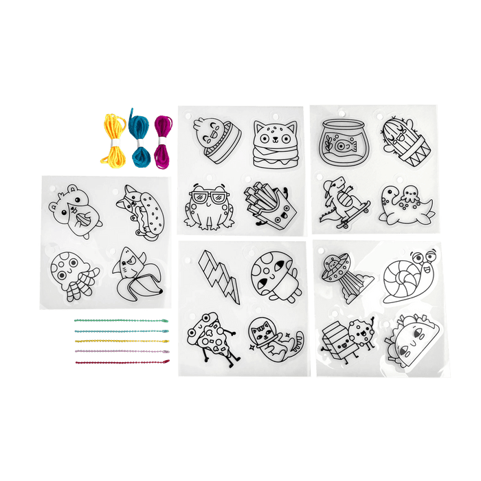 Content of Shrink-its! DIY Shrink Art Kit - Fun Friends including shrink sheets, colored ball chains and colored cords