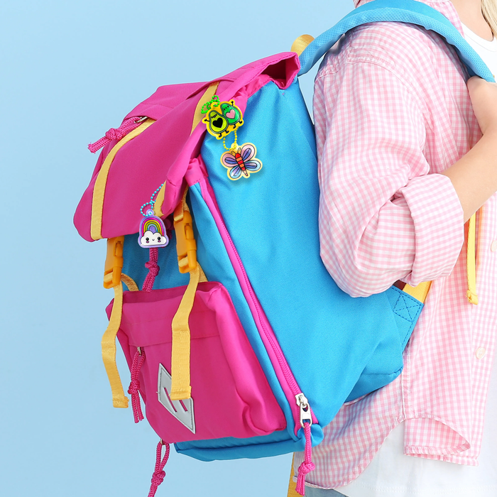 Completed charms on colorful backpack from Shrink-its! DIY Shrink Art Kit - Fun Friends