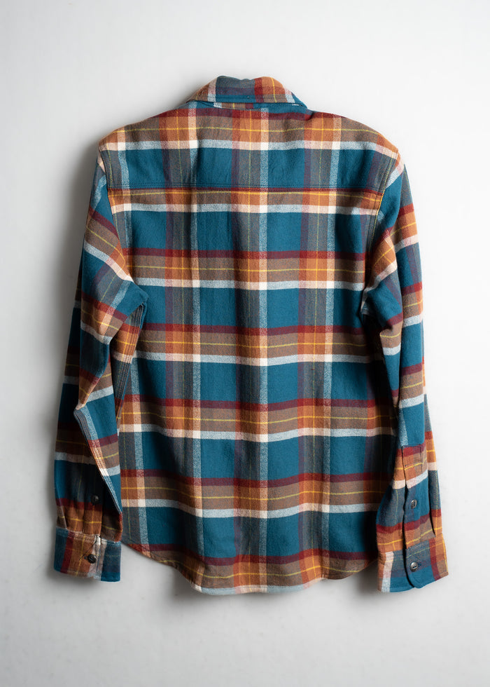 A blue, red, and yellow plaid flannel shirt displayed on a white background, showcasing its back and long sleeves.
