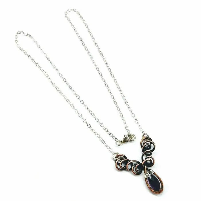 Silver and Copper Wire Sculpted Purple Crystal Drop Necklace with unique wire design and amethyst Swarovski drop.