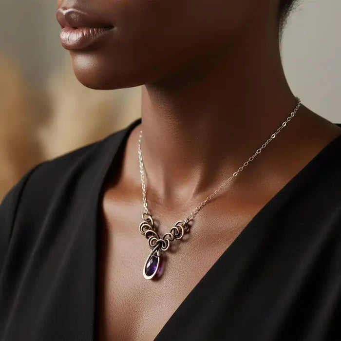 Silver and Copper Wire Sculpted Purple Crystal Drop Necklace worn by a model, showcasing elegance and artisan craftsmanship.