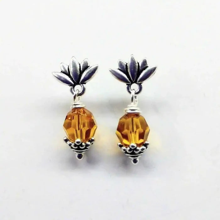 Silver Crystal Pineapple Steel Studded Earrings with topaz gemstone and floral accents.