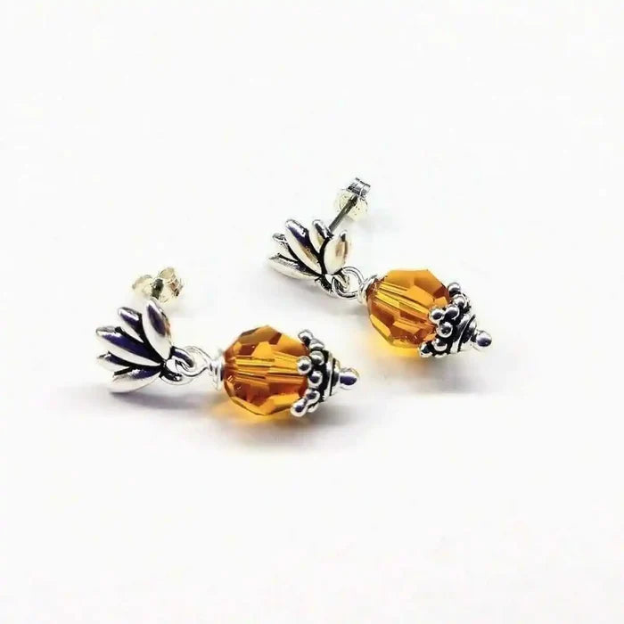 Silver Crystal Pineapple Steel Studded Earrings with topaz crystal design and pineapple details.