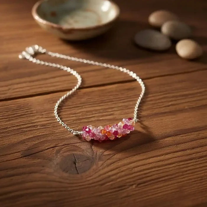 Silver Multi Color Spring Blossom Crystal Necklace displayed on a wooden surface, featuring vibrant Swarovski crystals.