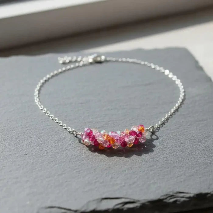 Silver Multi Color Spring Blossom Crystal Necklace featuring vibrant pink and orange Swarovski crystals on a silver chain.