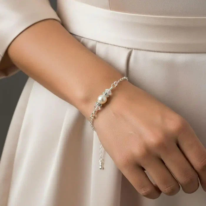 Silver Swarovski Crystal Pearl Bar Bridal Bracelet worn on a wrist, showcasing elegance and style for brides and special occasions.