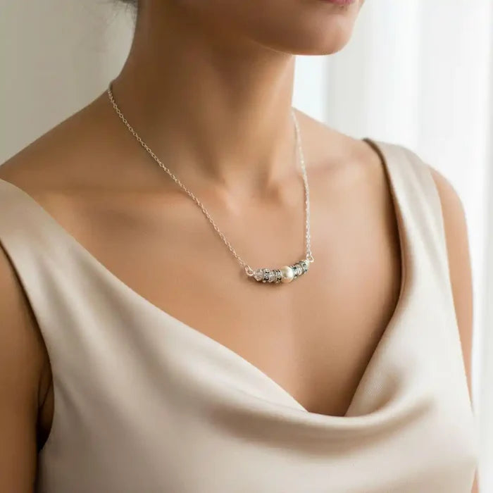 Silver Swarovski Crystal Pearl Bar Bridal Necklace worn by a model, showcasing elegance and style.