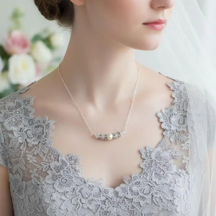 Silver Swarovski Crystal Pearl Bar Bridal Necklace worn by a bride with a lace dress and veil.