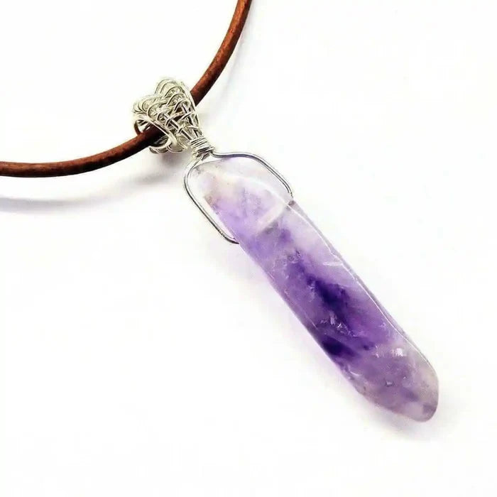 Silver Wrapped Light Amethyst Point Gemstone Necklace with a purple crystal pendant on a leather cord.