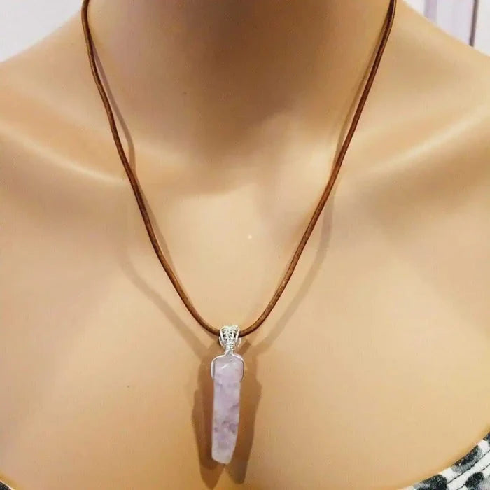 Silver Wrapped Light Amethyst Point Gemstone Necklace displayed on a mannequin featuring a light purple amethyst crystal pendant.