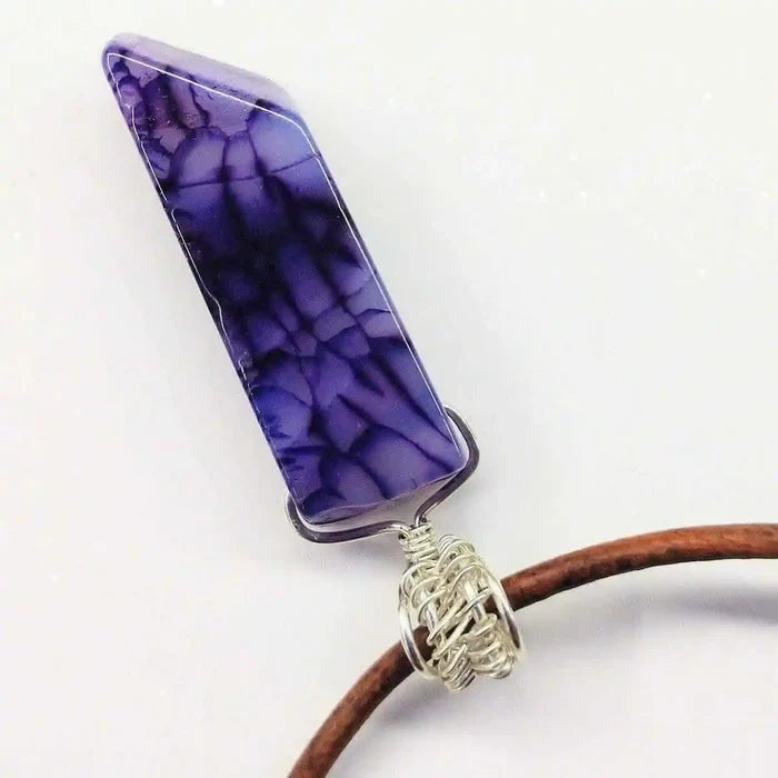 Silver Wrapped Purple Dyed Crackle Agate Point Necklace featuring a striking purple agate crystal pendant