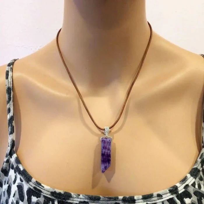 Silver Wrapped Purple Dyed Crackle Agate Point Necklace displayed on a mannequin with a brown leather cord.
