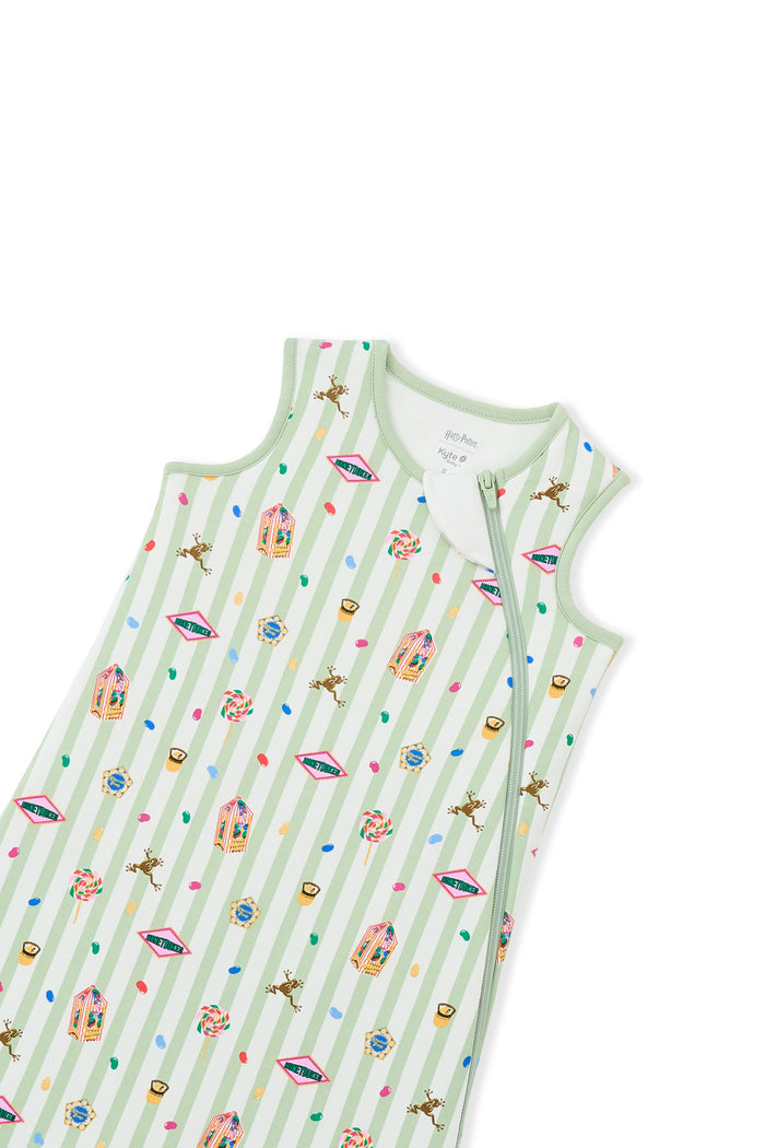 Zipper of green and white striped sleep bag with colorful Harry Potter patterns on a white background