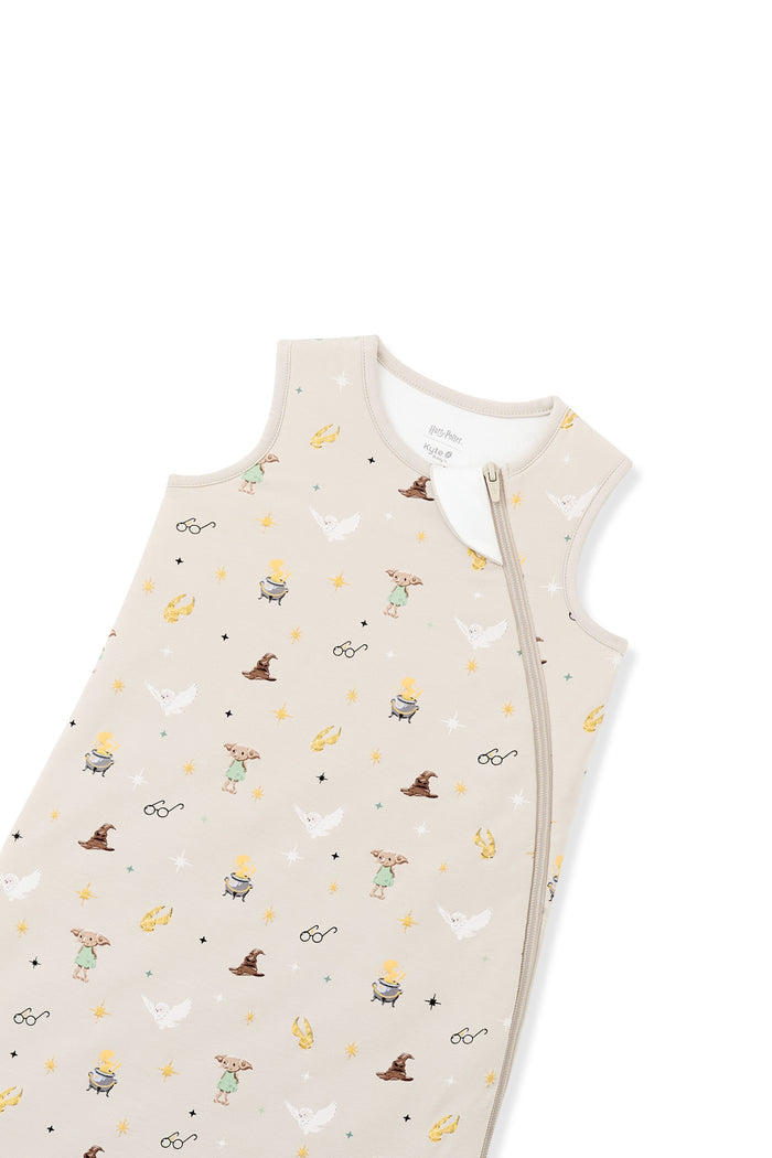 Zipper top part of beige sleep bag with Harry Potter print on a white background