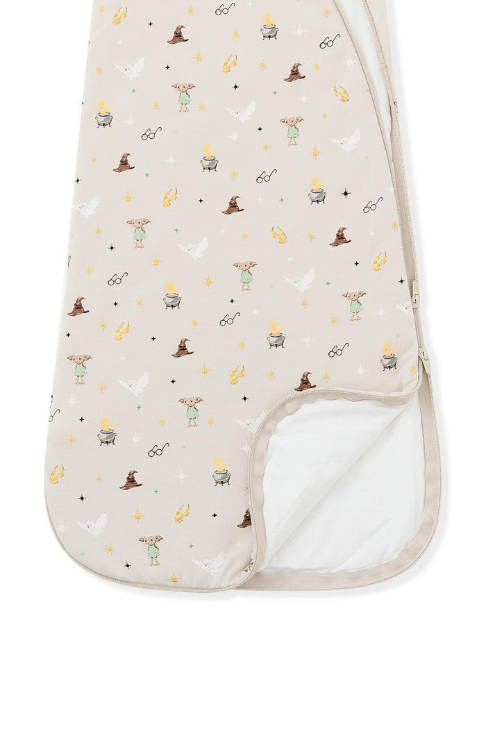 Bottom part of beige sleep bag with Harry Potter print on a white background