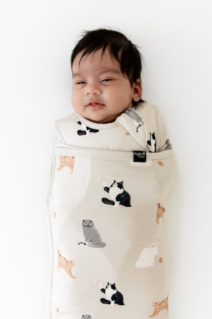 Close up of newborn wearing the Sleep Bag Swaddler in Fluffy Cat 1.0