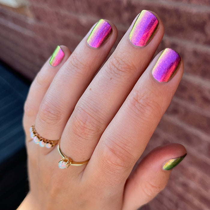 Close up shot of nails done with Smoulder Lite nail lacquer on fair skin tone.