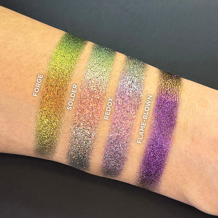 Wrist swatches of Forge, Solder, Redox and Flame-Blown on fair skin tone.