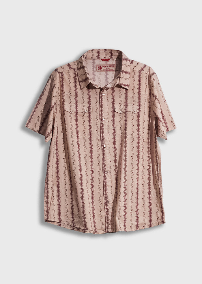 Short-sleeve beige shirt with red vertical patterns, button-up front, and two chest pockets, displayed against a white background.