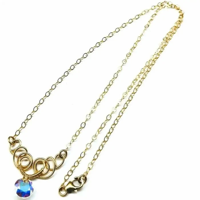Sparkly Crystal AB Wire Sculpted 14 KT Gold Filled Necklace with elegant wire design and sparkling crystal centerpiece.