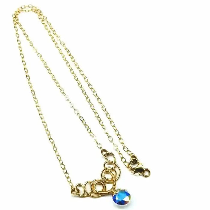 Sparkly Crystal AB Wire Sculpted 14 KT Gold Filled Necklace showcasing intricate wire design and a vibrant crystal bead.