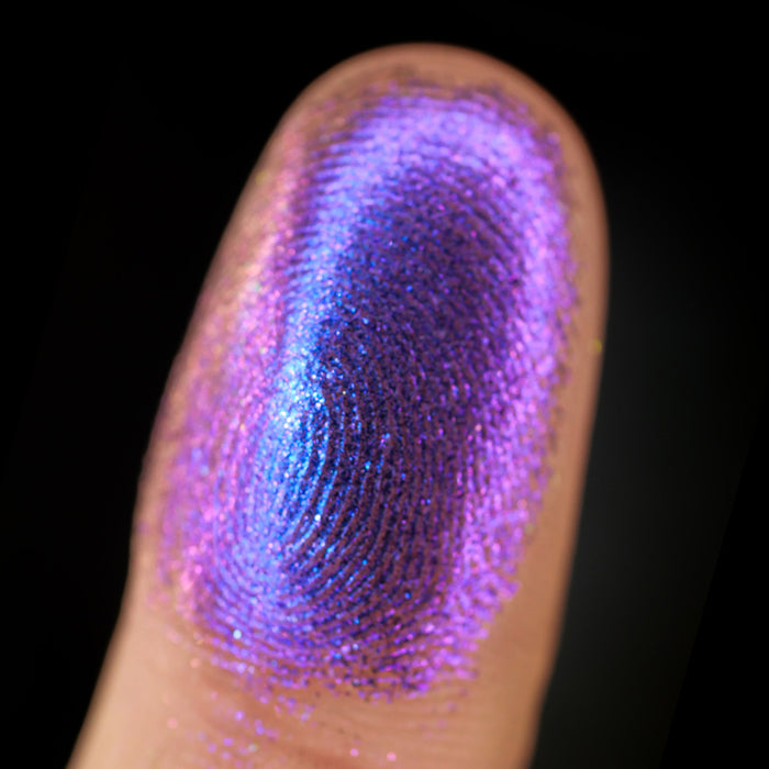 Macro finger swatch of Spire Lite on fair skin tone.