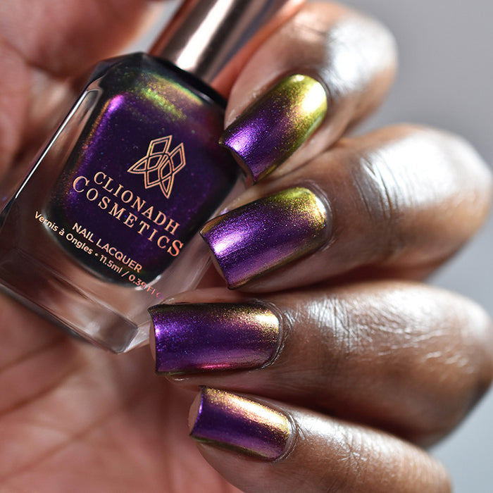Close up of nails done with Flame-Blown nail lacquer on deep skin tone.