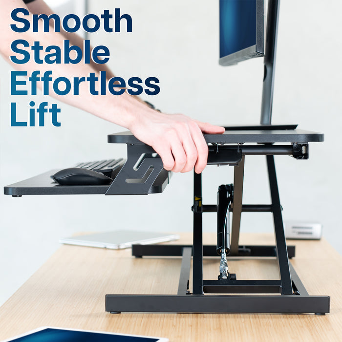 Heavy-duty height adjustable desk converter monitor riser with 2 tiers.
