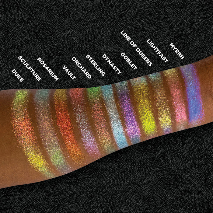 Top angled arm swatches of Sterling and the rest of the Holiday Expansion Bundle shades on deep skin tone.