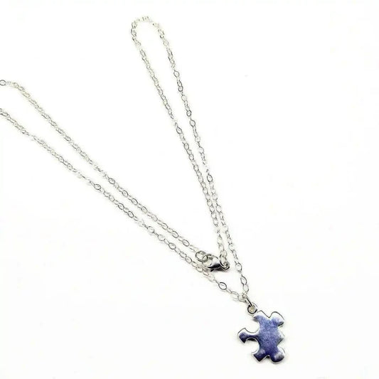 Sterling Silver Autism Awareness Puzzle Piece Chain Necklace displayed on a white background with a delicate chain.