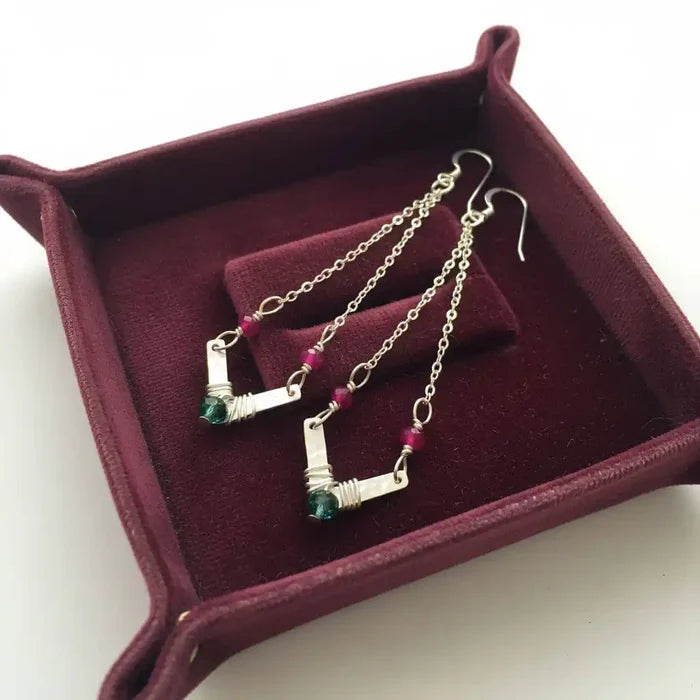 Sterling Silver Chevron Hot Pink Green Gemstone Earrings displayed in a burgundy jewelry box with a velvet lining.