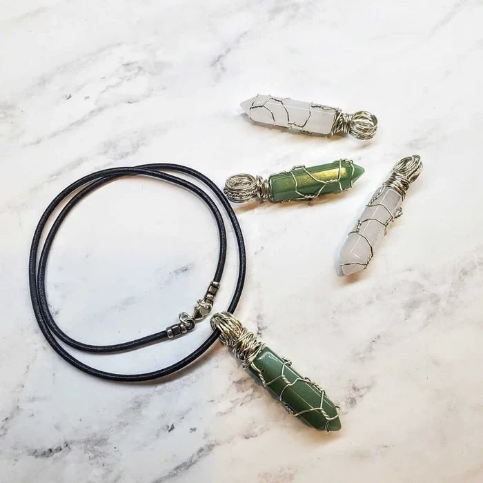 Sterling Silver Messy Wire Wrap Gemstone Crystal Pendant with leather cord and various wire-wrapped crystals.